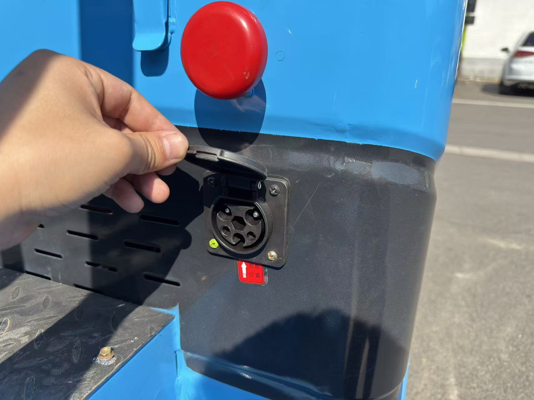 BaGong electric forklift charging port and power switch interface close-up